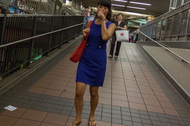 A commuter tries to gird herself against the stench of the Herald Square station in the summer of 2014.